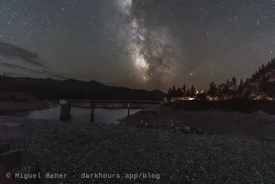 The Milky Way over the intake tower and rocky shore at Applegate Lake, Oregon