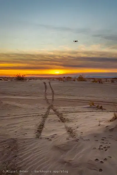 Drone flying over tire tracks at sunset, Knolls Recreation Area, Utah