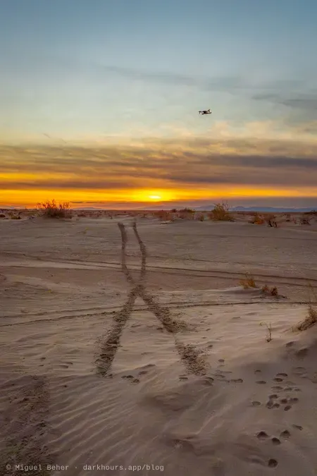 Drone flying over tire tracks at sunset, Knolls Recreation Area, Utah