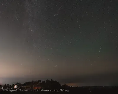 Three Perseid meteors with the Andromeda Galaxy and the Pleiades over the Mt Ashland ski lodge, Oregon