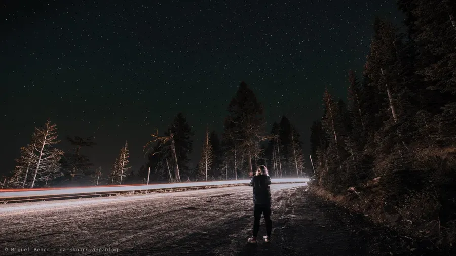 Nighttime photo on Mt. Ashland, Oregon, with a person in front of a light stream